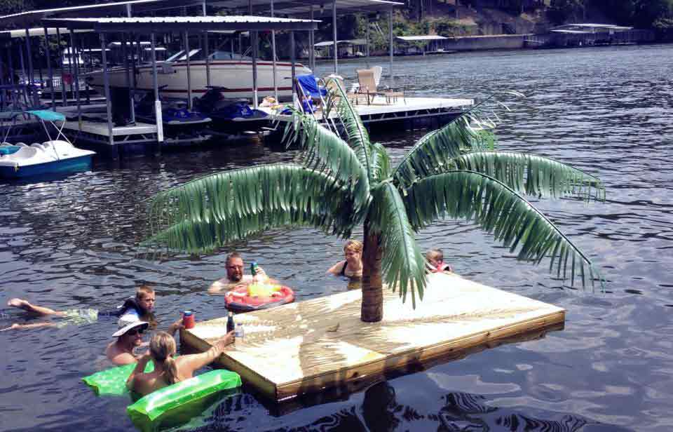 image of a fabricated palm tree floating in a pool
